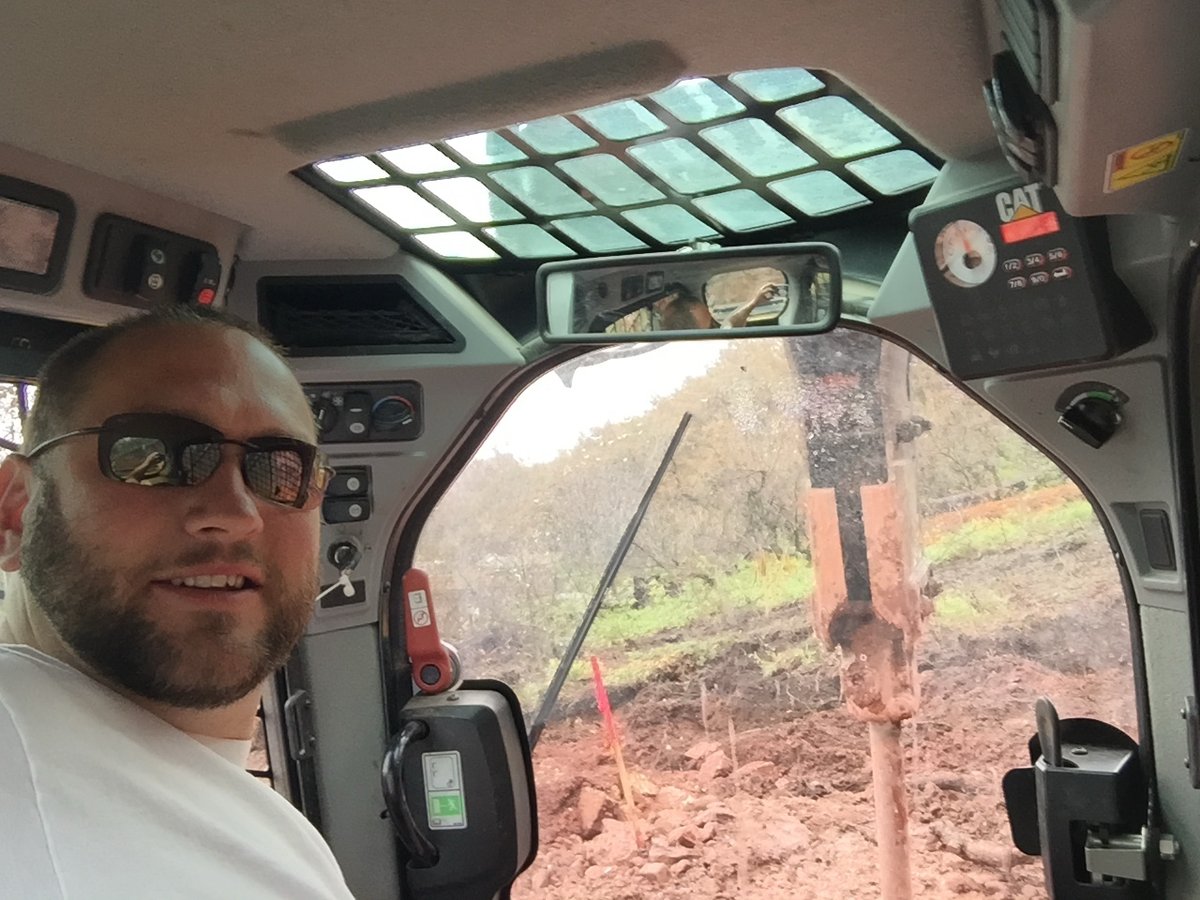 Steve Combs operating an excavator on a foothills building site