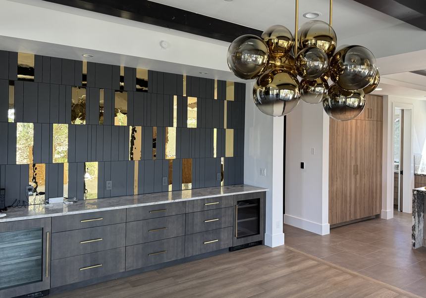Bar and entertaining wall with statement lighting