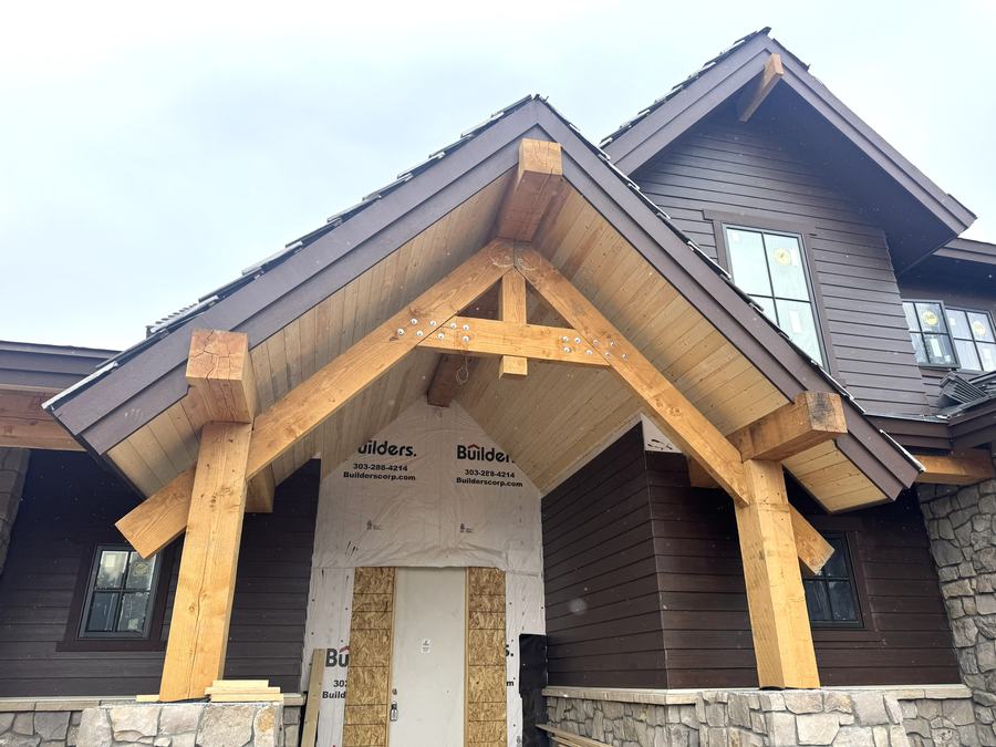 Mountain-modern timber home under construction in Evergreen