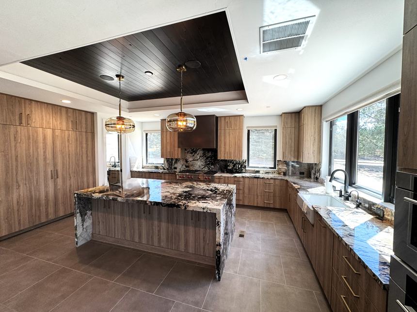 Dining and kitchen with statement lighting